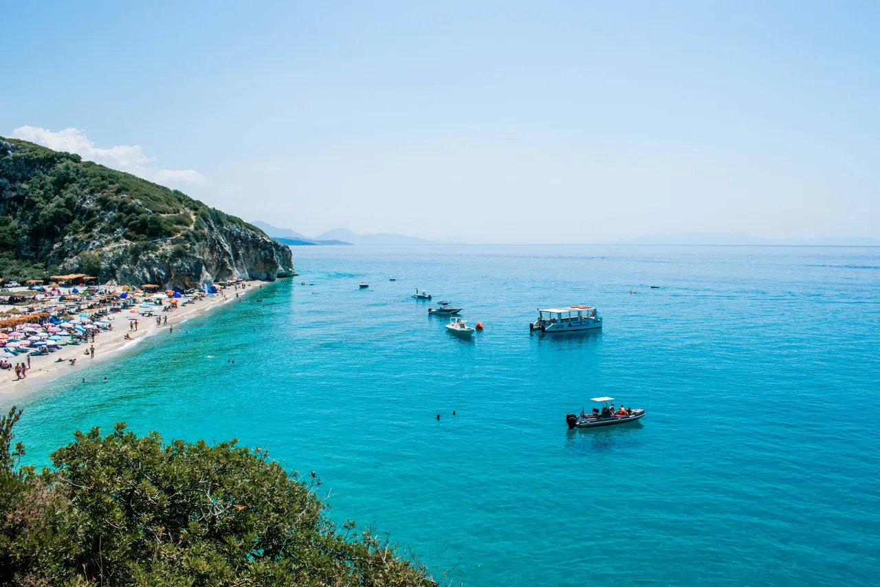 Gjipe beach at the mouth of its canyon, between white cliffs